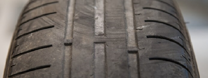 When are my tires considered worn out?